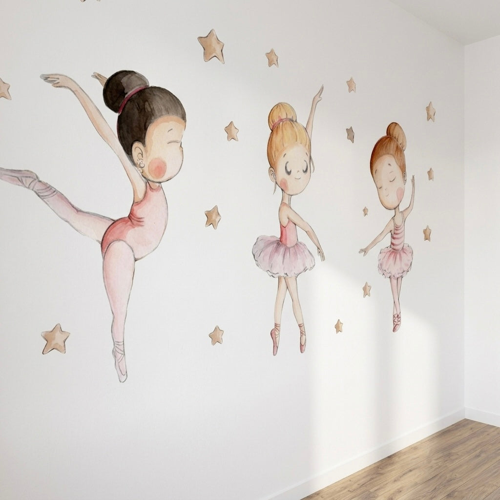 Three charming ballet dancers are illustrated on a white wall, each in different poses, wearing pink tutus and ballet shoes. Golden stars are scattered around them, creating a whimsical and enchanting atmosphere, perfect for a childs room.