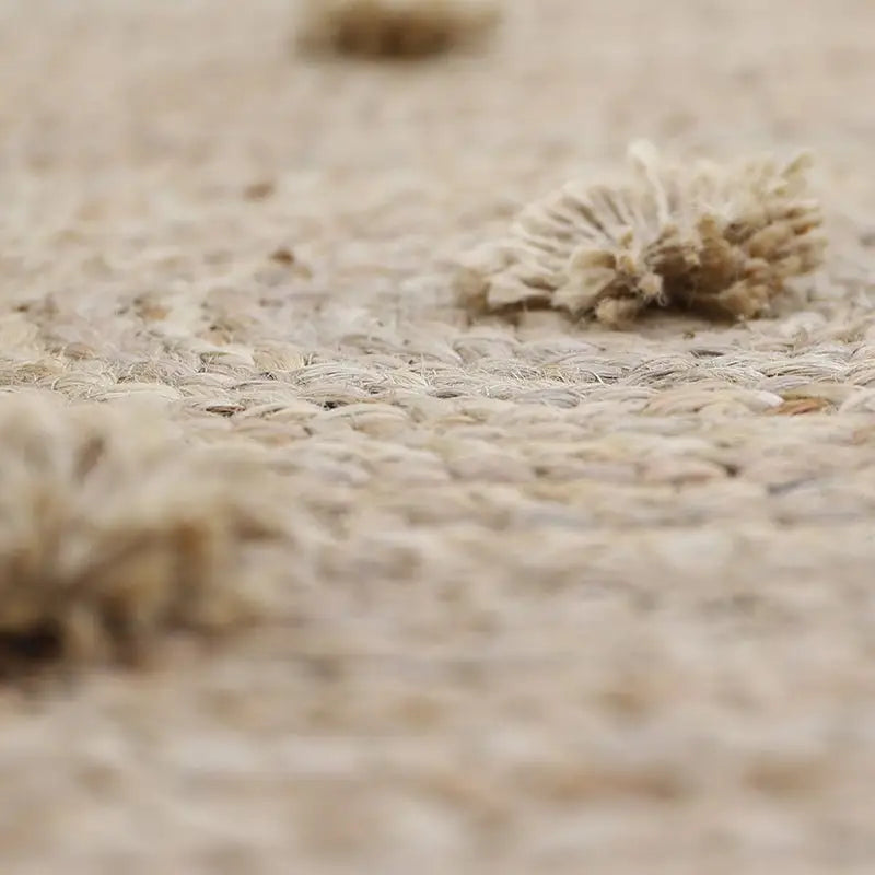 Tapis rond jute avec pompons SISKA - Sueños de Cigueña