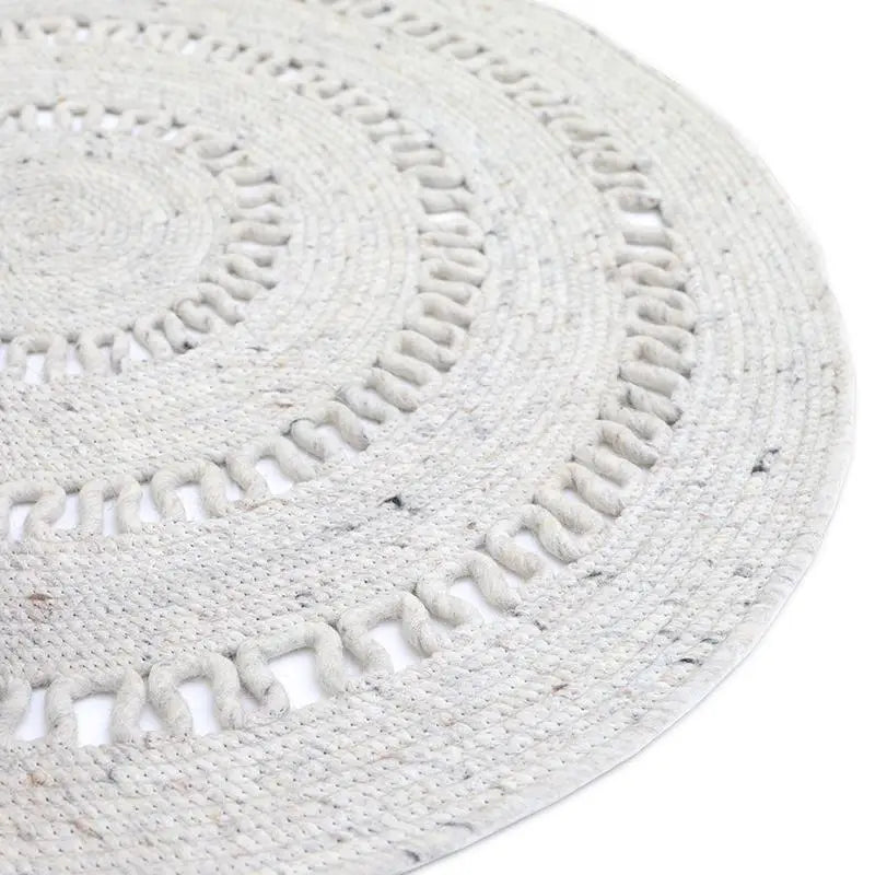Tapis laine feutrée rond ajourée BIBEK NATUREL M - Sueños de Cigueña