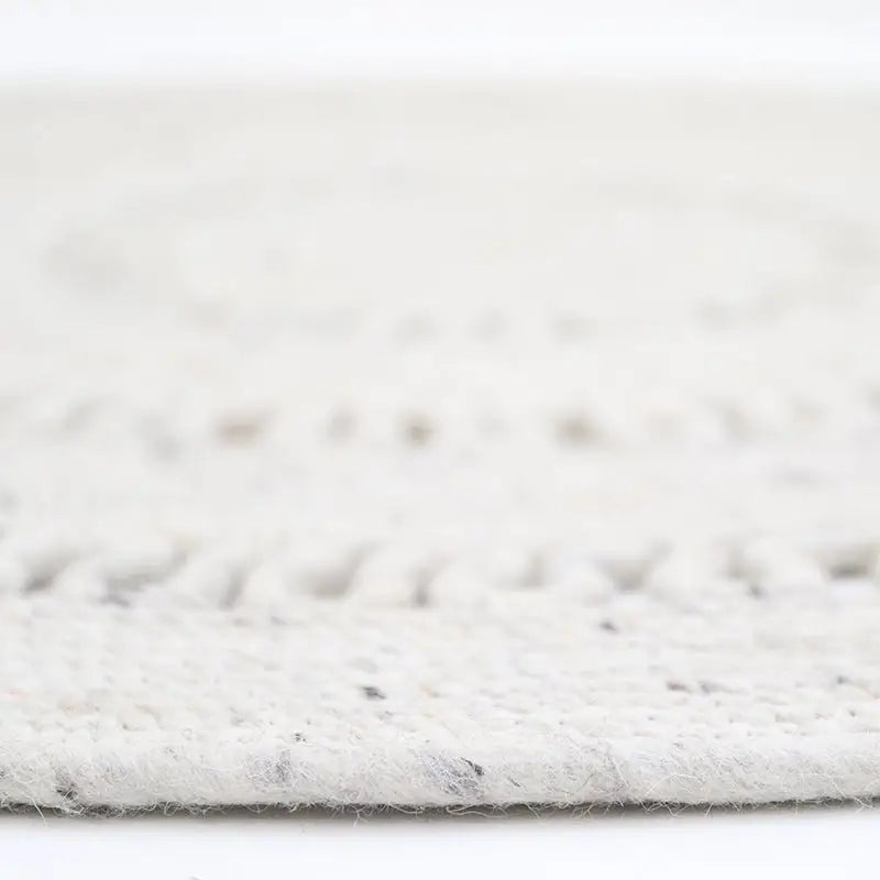 Tapis laine feutrée rond ajourée BIBEK NATUREL S - Sueños de Cigueña
