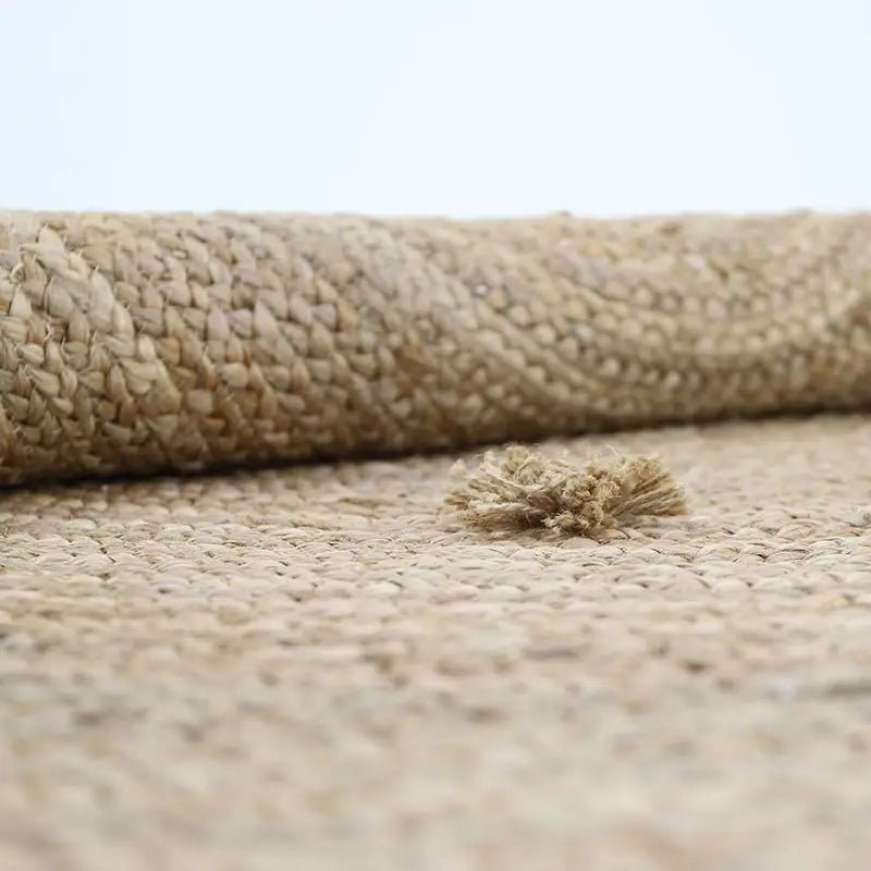 Alfombra de jute con pompones SISKA 140cm - Sueños de Cigueña